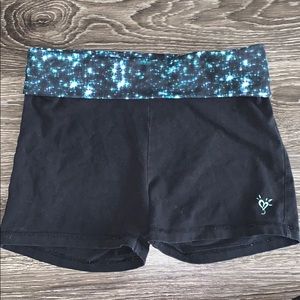 Justice black compression shorts with galaxy band